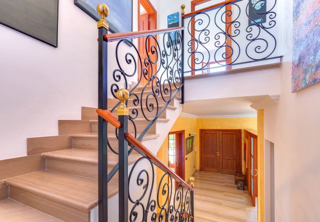 Staircase with landings and a cast iron railing.  Staircase with landings and a cast iron railing.