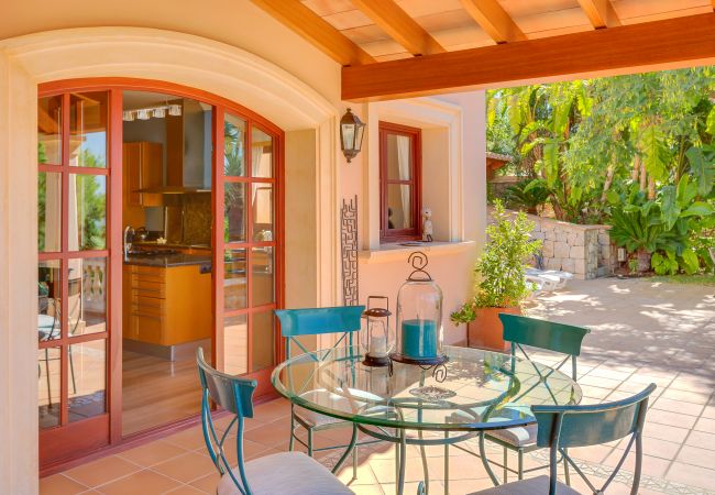 Covered outdoor dining area with views. Covered outdoor dining area with views.